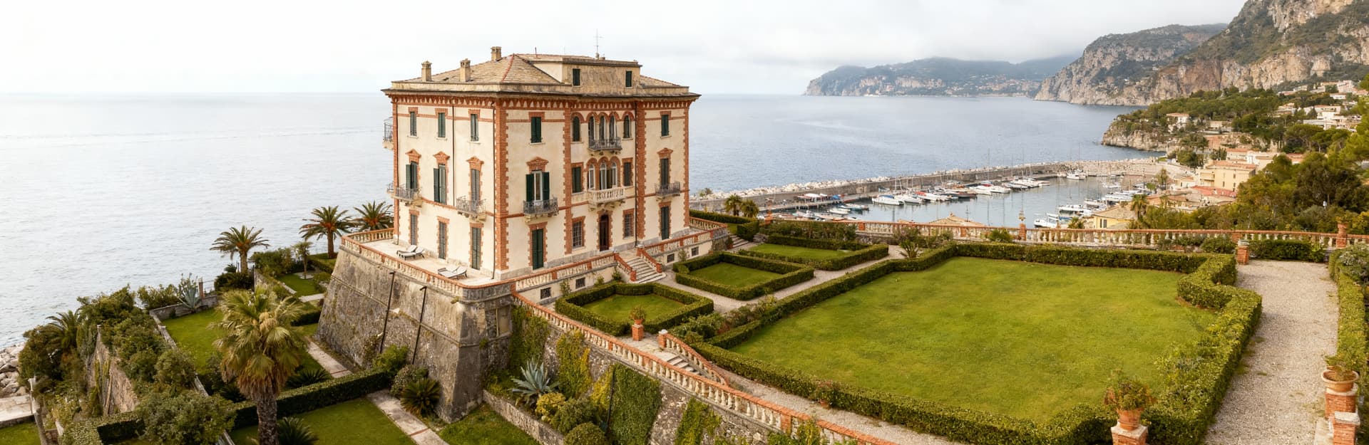 Luxury real estate for sale in Genoa, showcasing historic villas, elegant penthouses, and stunning coastal views.