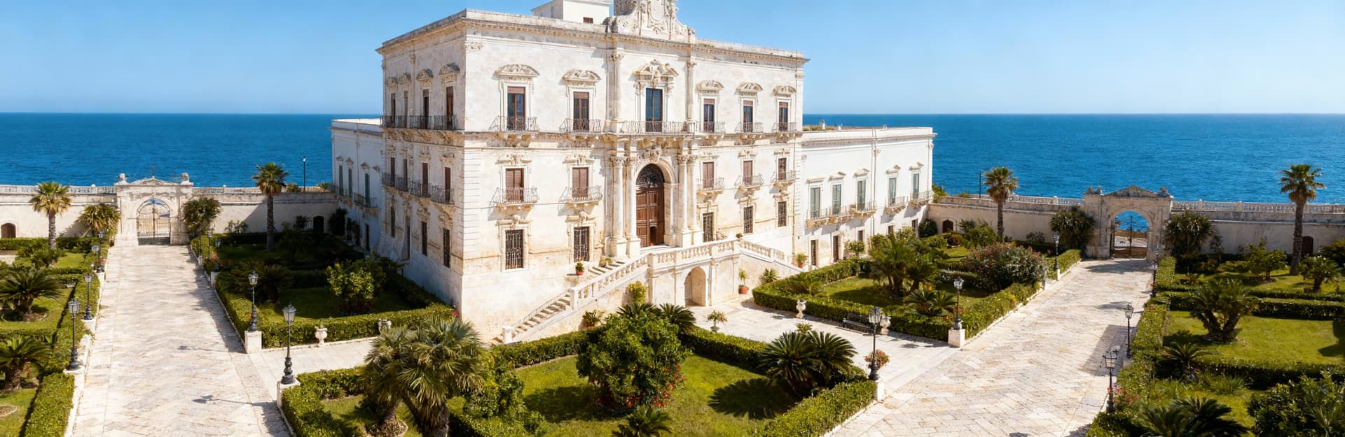 Stunning historic buildings for sale in Syracuse, Sicily, showcasing unique architecture and breathtaking coastal views.