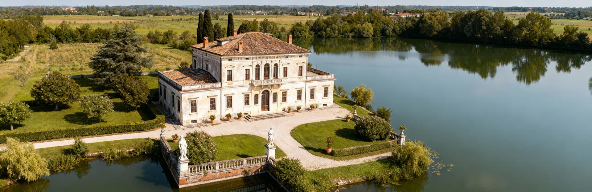 Luxury villas for sale in Mantova province, showcasing stunning lakes and elegant historic estates.