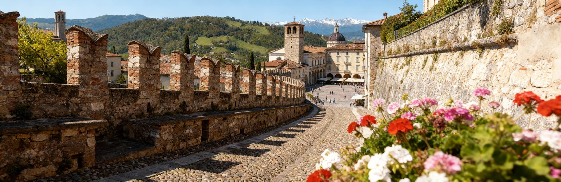 City properties for sale in Bergamo province, showcasing historical architecture and stunning views of the Prealps.