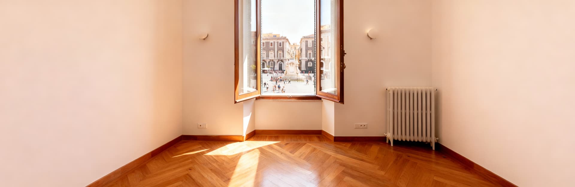 Luxury apartments for sale in Catania, showcasing stunning views, historical architecture, and vibrant urban life.
