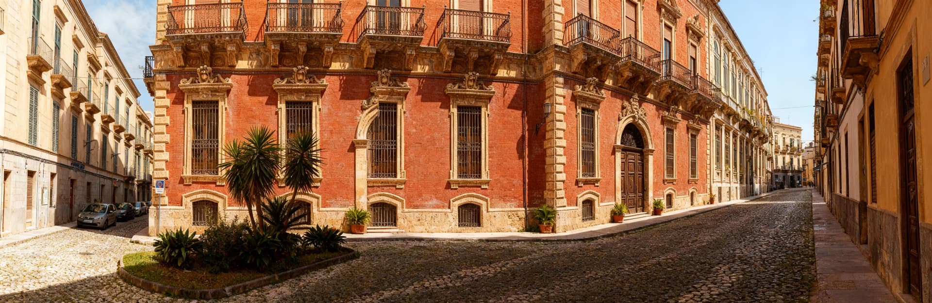 Luxury villas for sale in Syracuse, overlooking the sea, featuring stunning views, historic charm, and exclusive beachfront access.