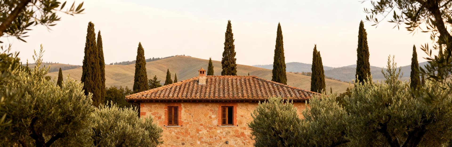 Rustic estates for sale in the Tuscan countryside near Siena, showcasing stunning landscapes of hills, vineyards, and olive groves.
