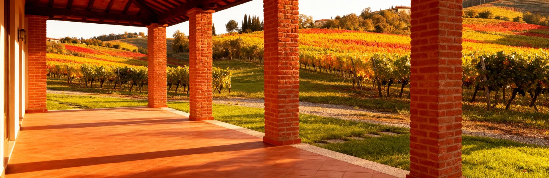 Arezzo countryside showcasing charming agriturismos for sale, surrounded by vineyards and historic architecture in Tuscany.