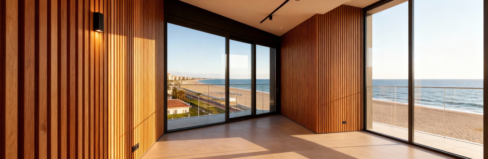 Attico di lusso in vendita a Pescara, design contemporaneo con vetrate sul mare, dettagli eleganti e luce mattutina vivace.