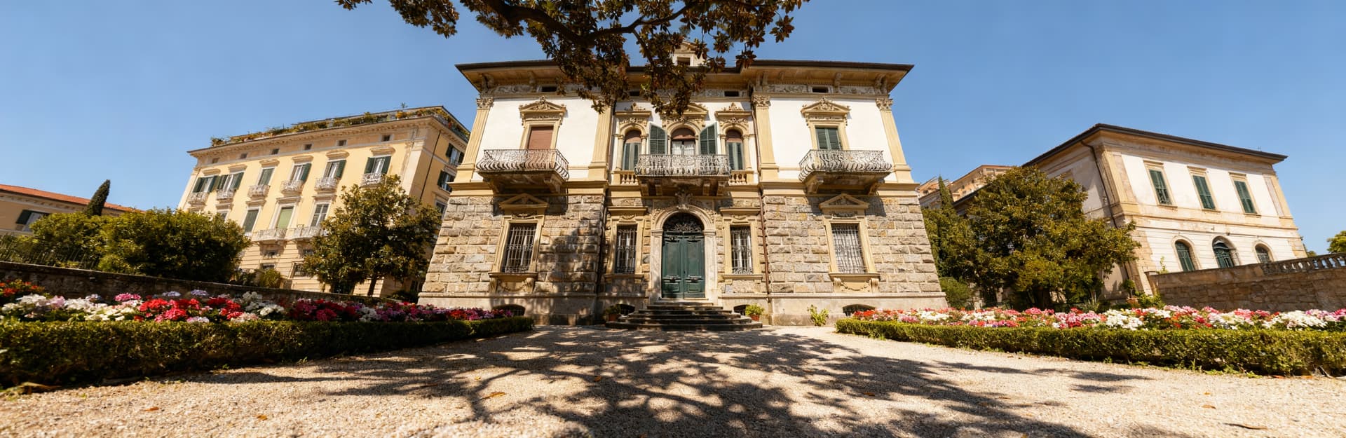 Stunning view of Genoa, Liguria, showcasing seaside apartments for sale near the picturesque Mediterranean coastline.