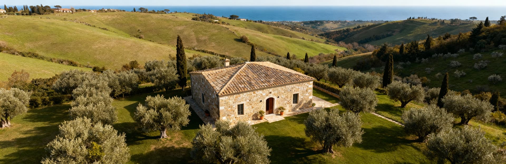 Charming Tuscan farmhouses for sale in Livorno, surrounded by olive groves and scenic hills, embodying luxury living.