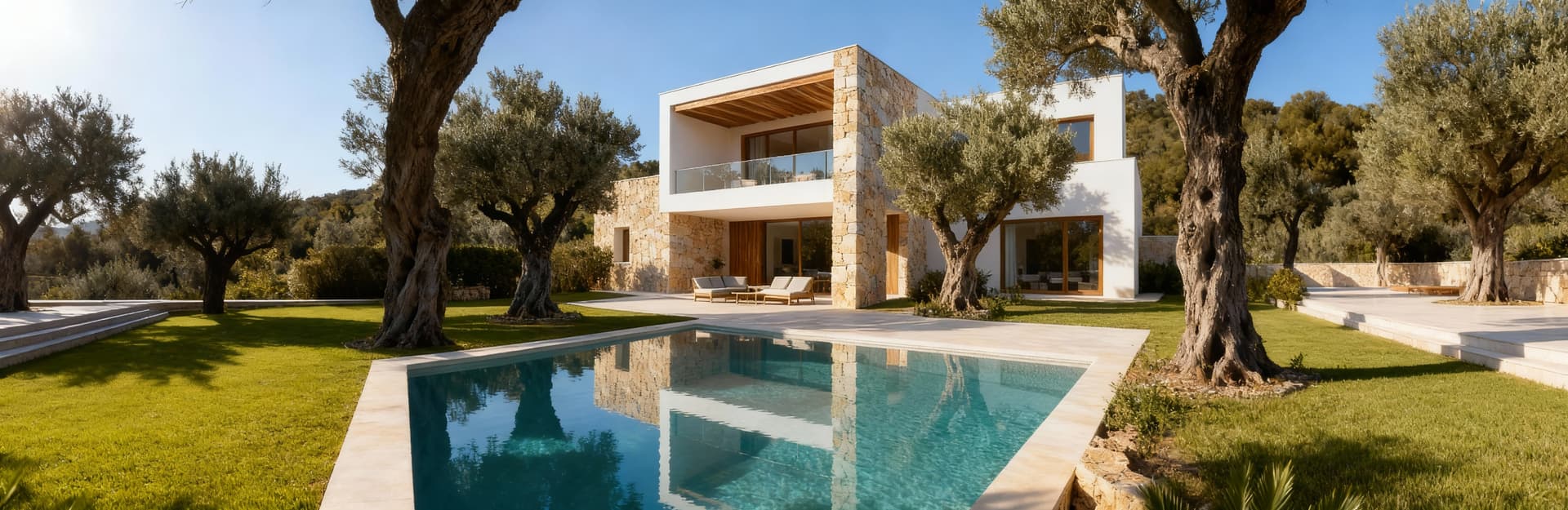 Luxury villas for sale in Ibiza, showcasing stunning landscapes of turquoise waters and lush hills, perfect for exclusive living.