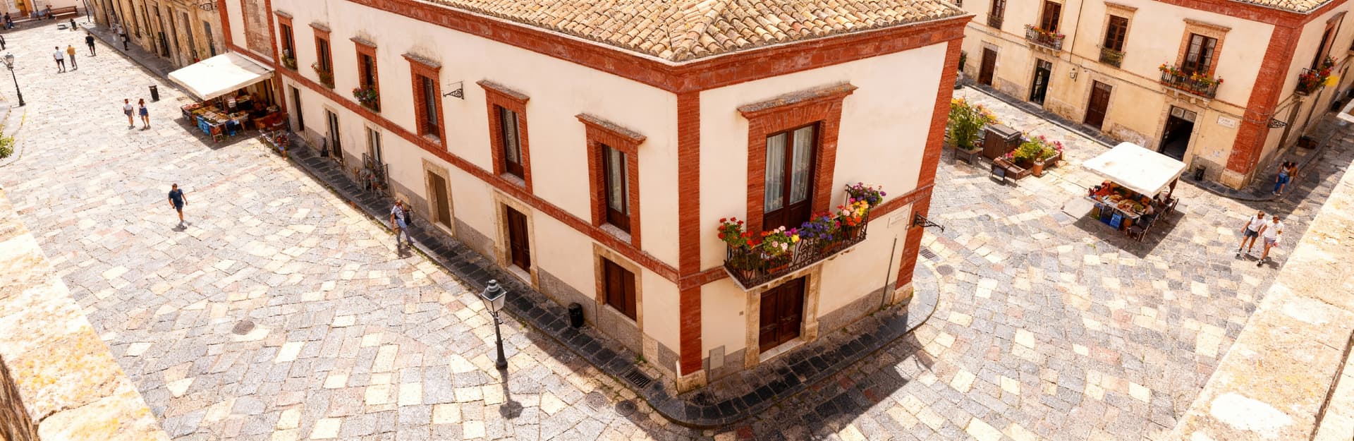 Historic city houses for sale in Sicily, blending traditional architecture with modern comforts in vibrant urban settings.