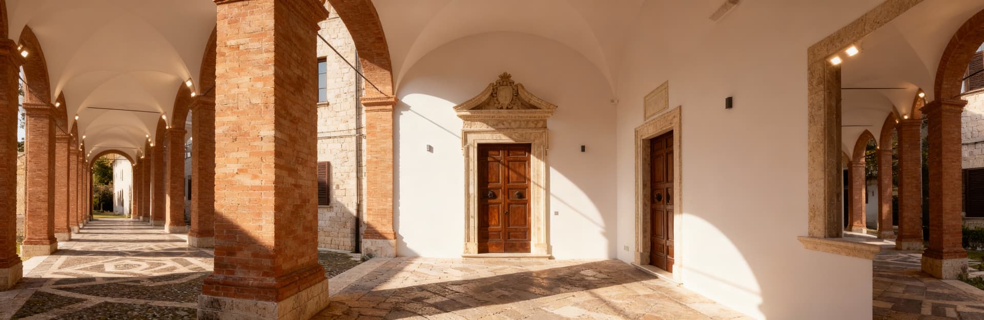 Luxury real estate for sale in Ascoli Piceno's historic center, featuring elegant palaces and modern apartments in a vibrant setting.