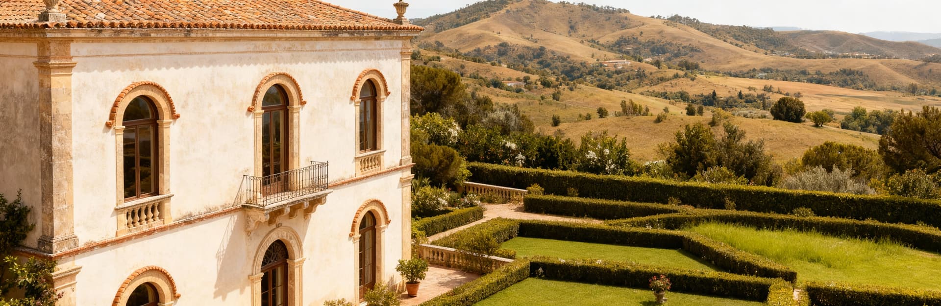 Exclusive villas for sale in Sicily, featuring stunning architecture, lush gardens, and panoramic terraces for upscale living.