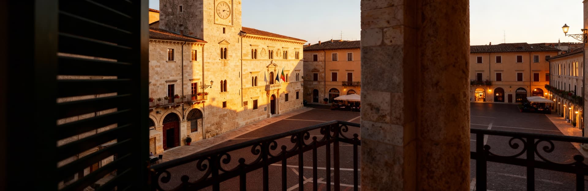 Modern apartments for sale in Ascoli Piceno's historic center, surrounded by medieval squares and stone buildings.