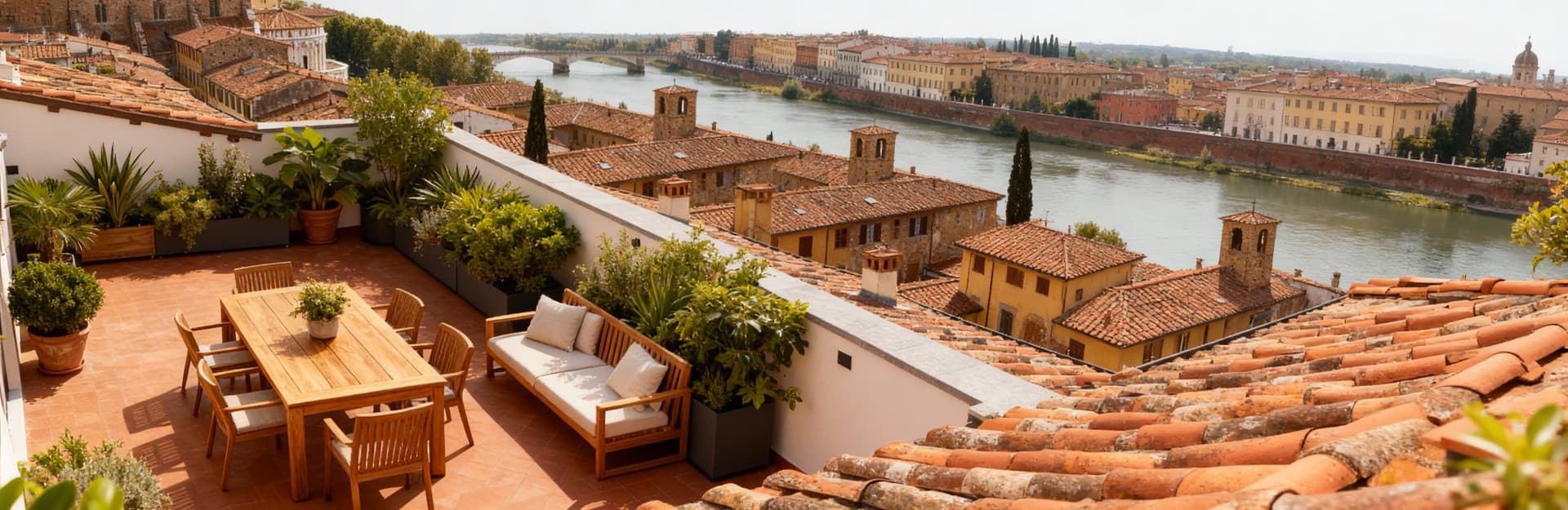 Luxury penthouses for sale in Pisa city center, featuring panoramic terraces with views of the Arno River and medieval rooftops.