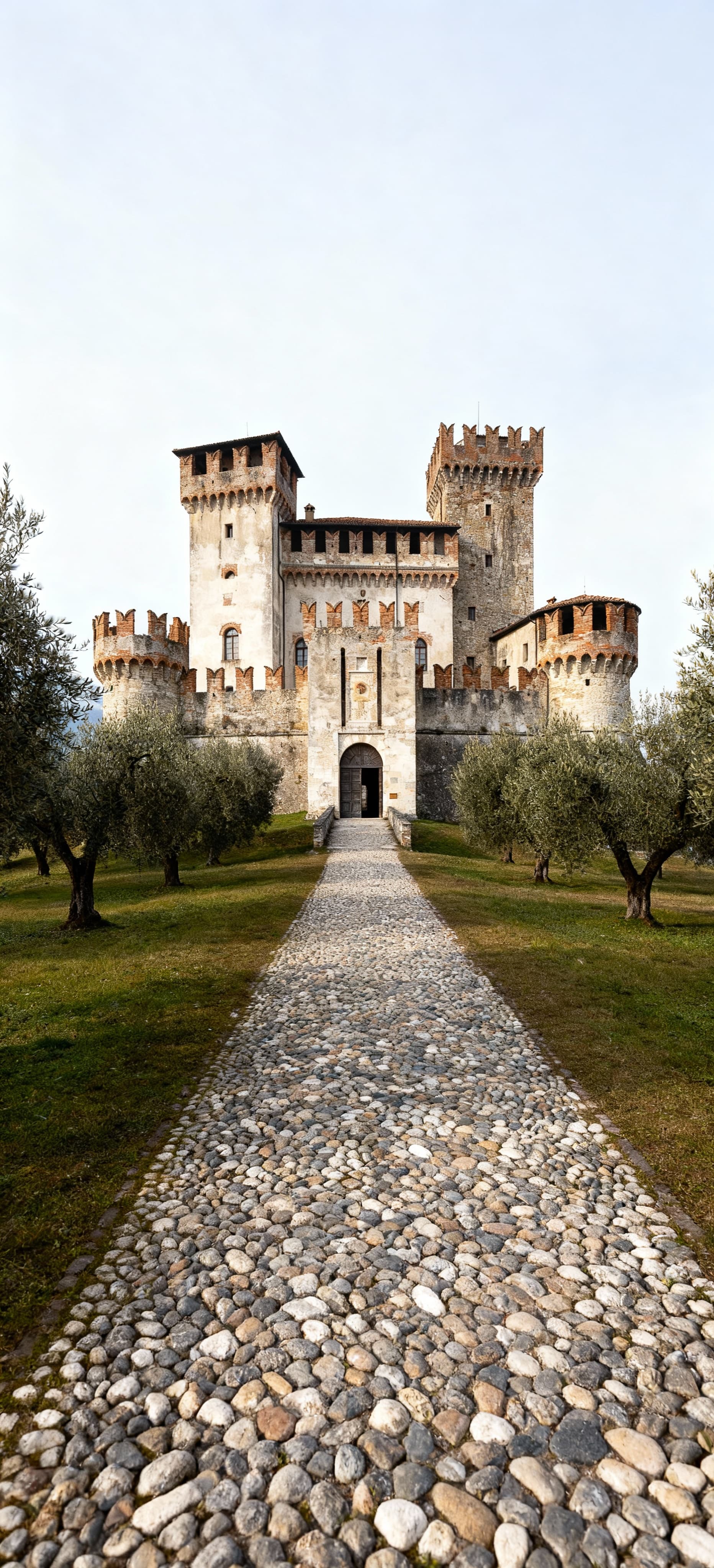 Castles for sale in Lombardy's Città, surrounded by lush hills and historic towns, offering unique architectural beauty.