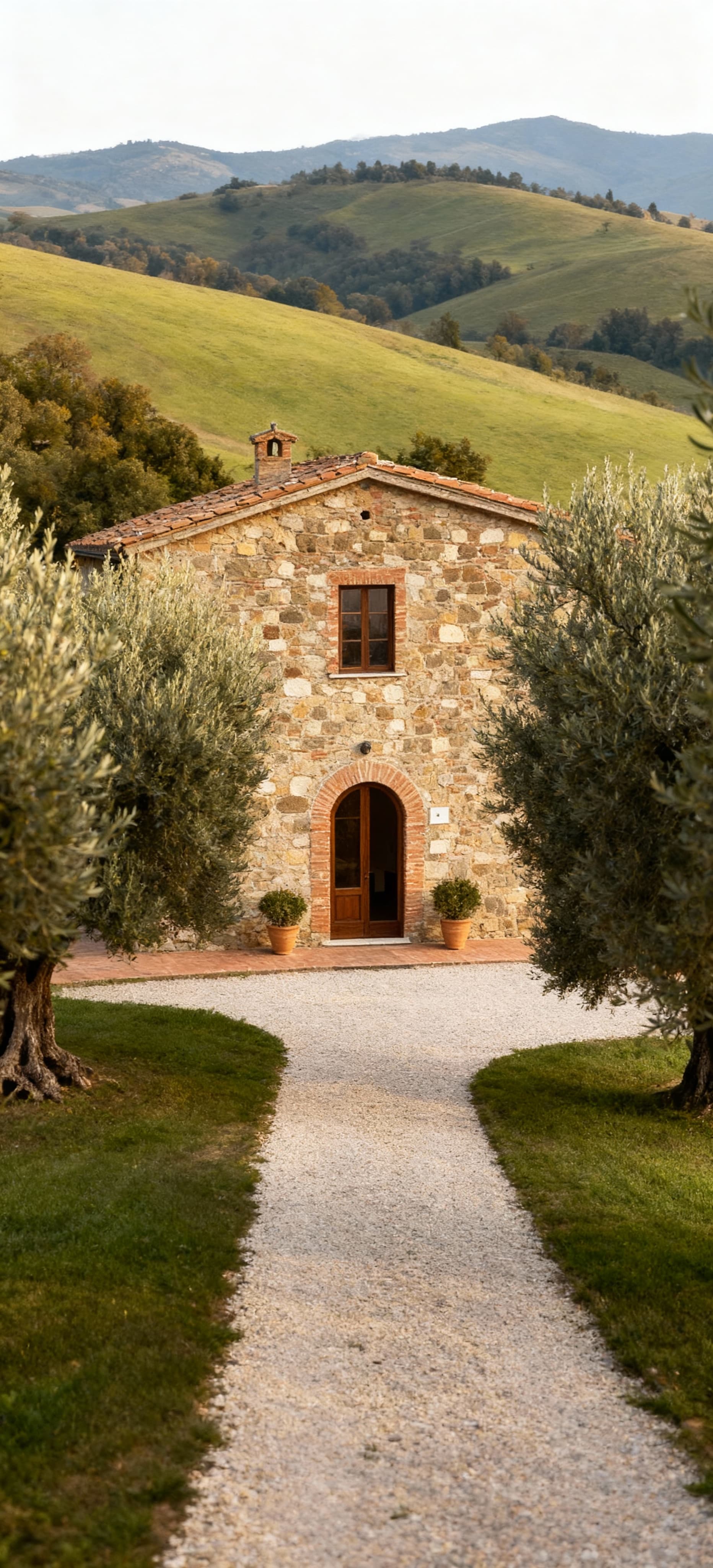 Rustic villas and farmhouses for sale in Lucca, Tuscany, surrounded by rolling hills and ancient olive groves.