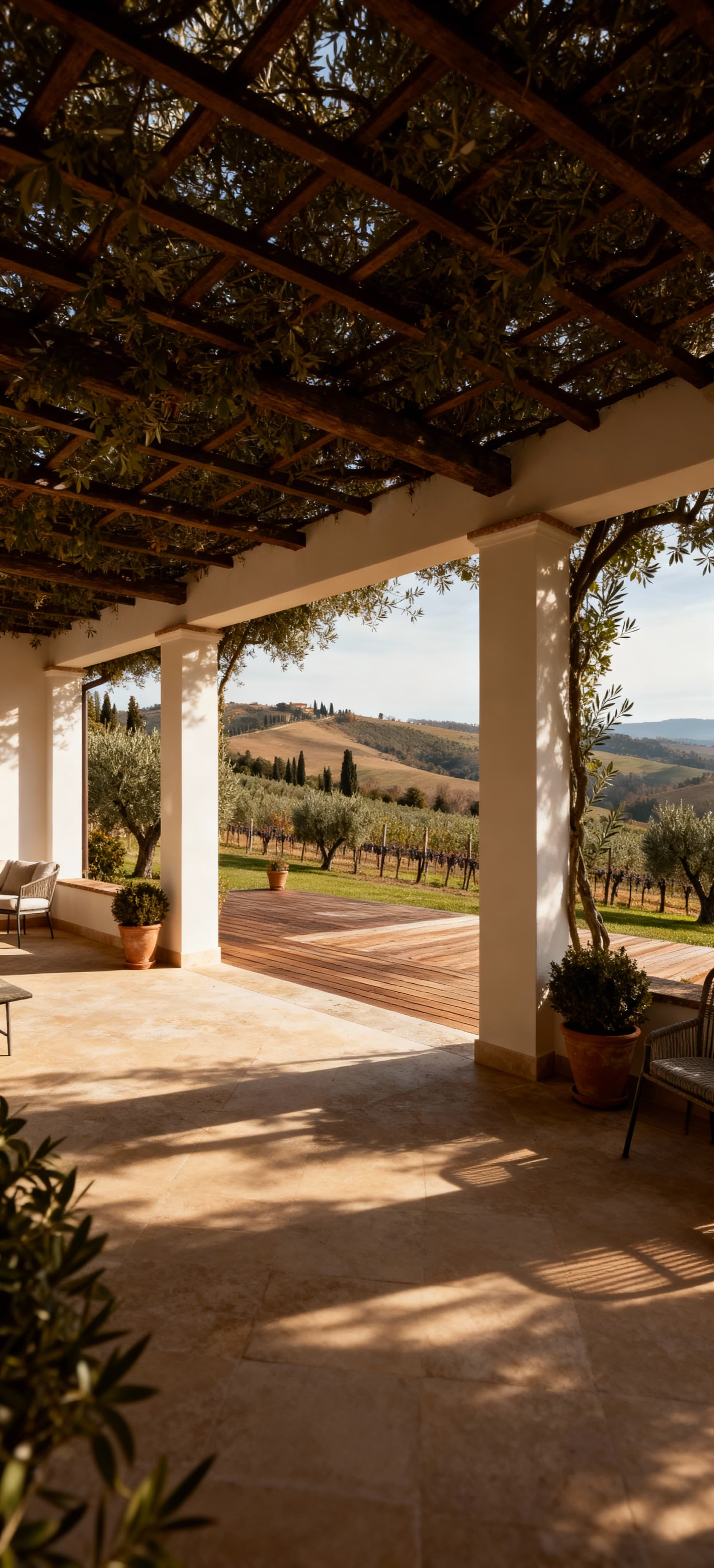 Villa di lusso in Lombardia, circondata da uliveti e vigneti, con vista panoramica su colline e luce invernale morbida.