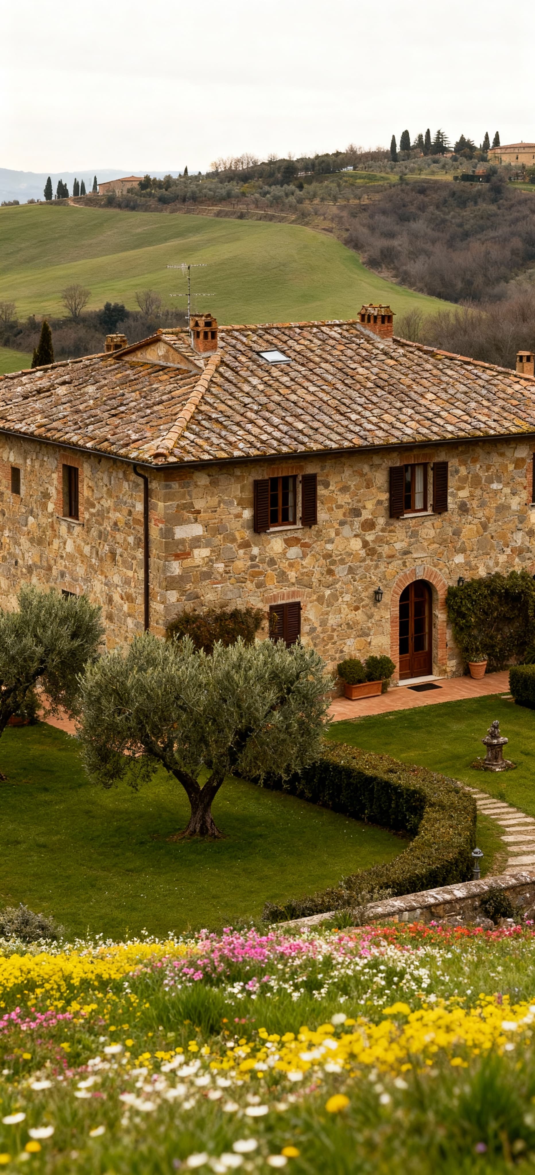 Charming Tuscan farmhouses for sale in Versilia, surrounded by lush hills and ancient olive groves, offering serene countryside living.