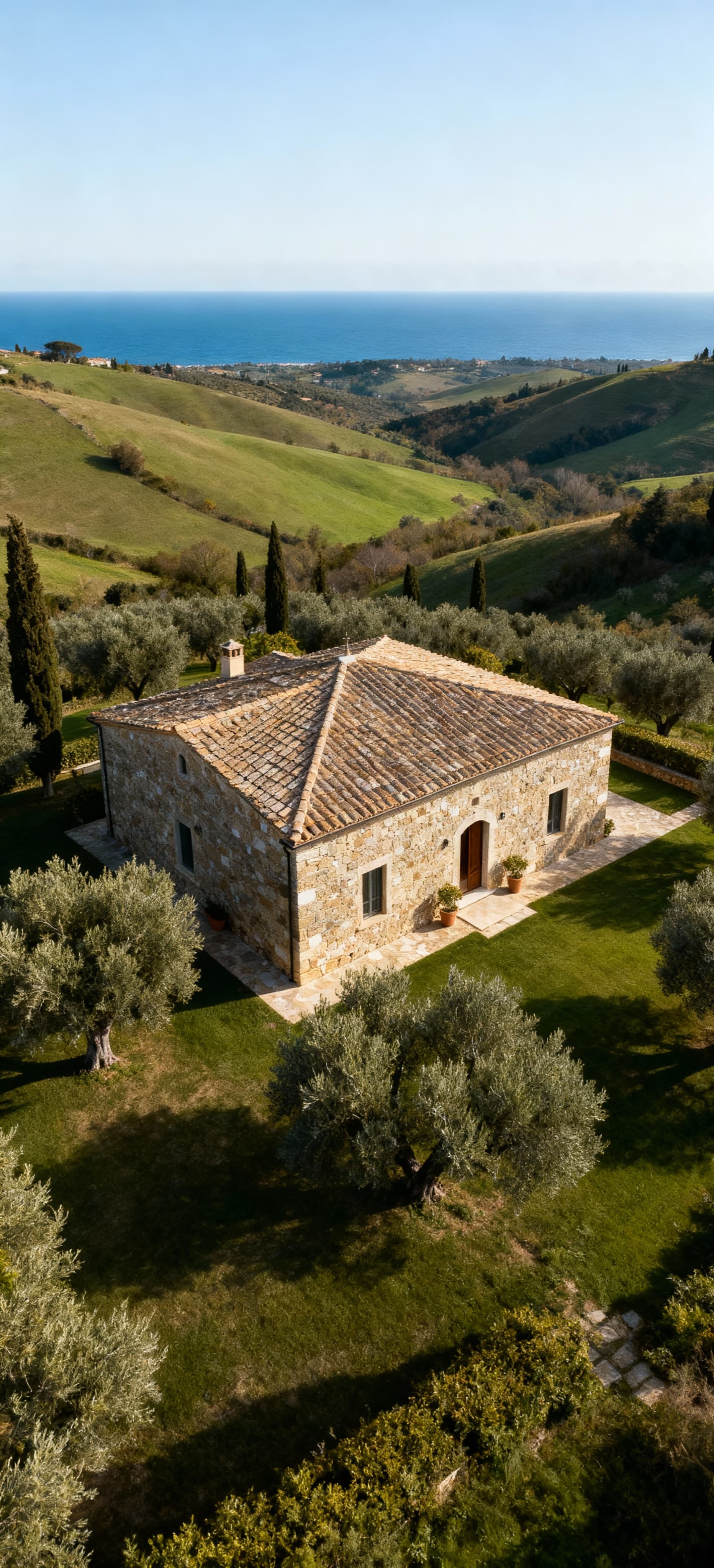 Charming Tuscan farmhouses for sale in Livorno, surrounded by olive groves and scenic hills, embodying luxury living.