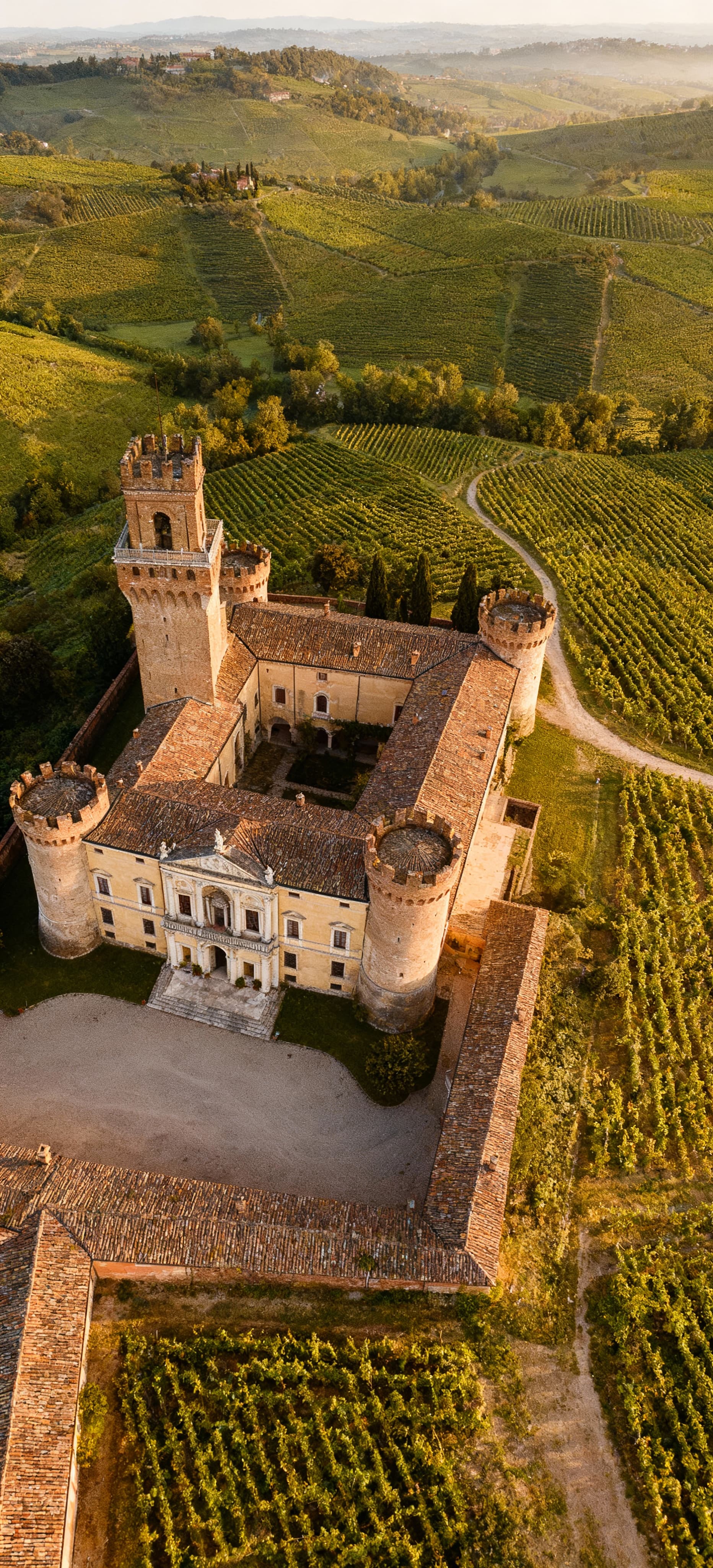 Luxury real estate for sale in Reggio Emilia, featuring stunning historic villas and modern penthouses amidst scenic landscapes.