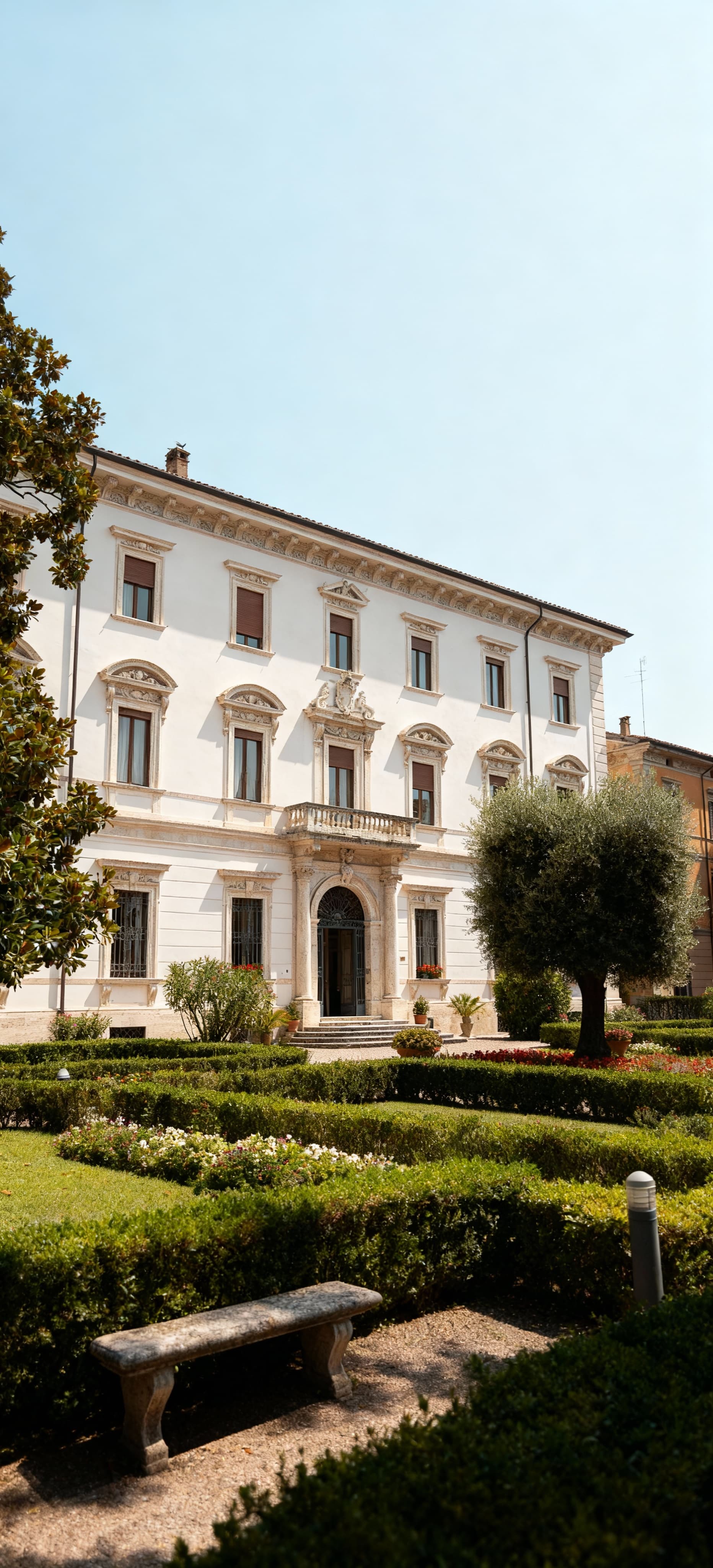 Rustic farmhouses for sale in Bolzano, surrounded by vineyards and mountains, showcasing the region's rural charm.