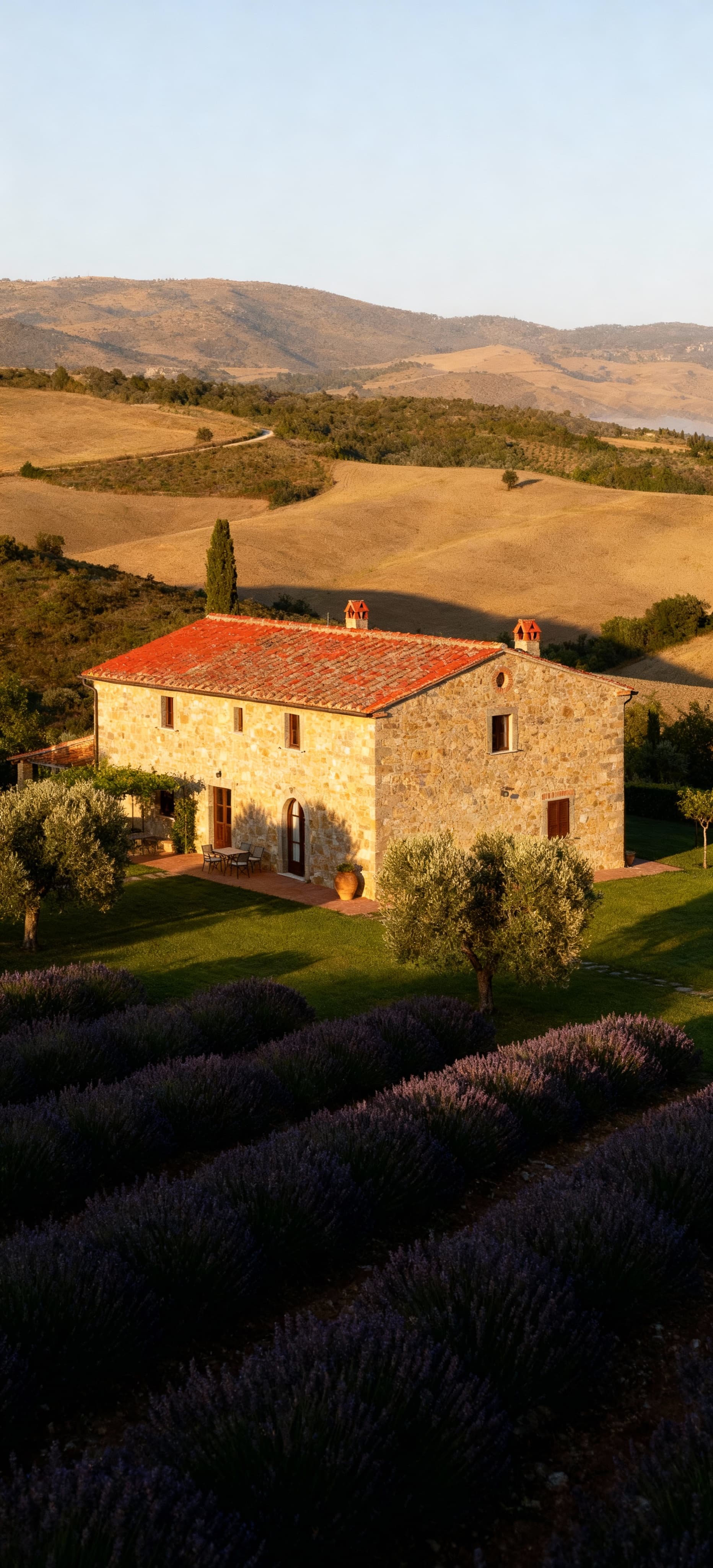Semi-detached houses for sale in the Tuscan countryside, featuring private green spaces and traditional architecture.