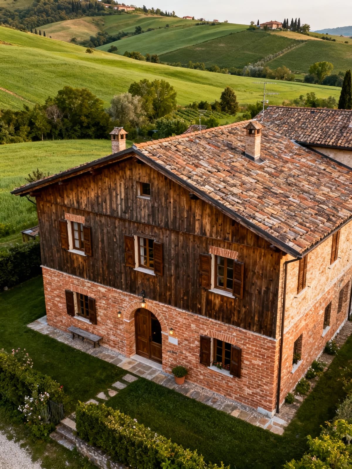 Charming rustic homes in Veneto's Treviso hills, featuring natural wood and brick facades, surrounded by lush greenery.