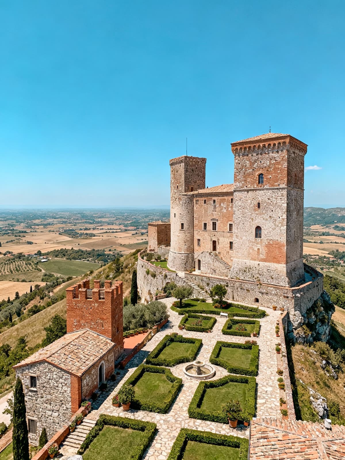 Historic castles amidst the lush hills of Lazio showcase elegant towers and manicured gardens under a clear summer sky.