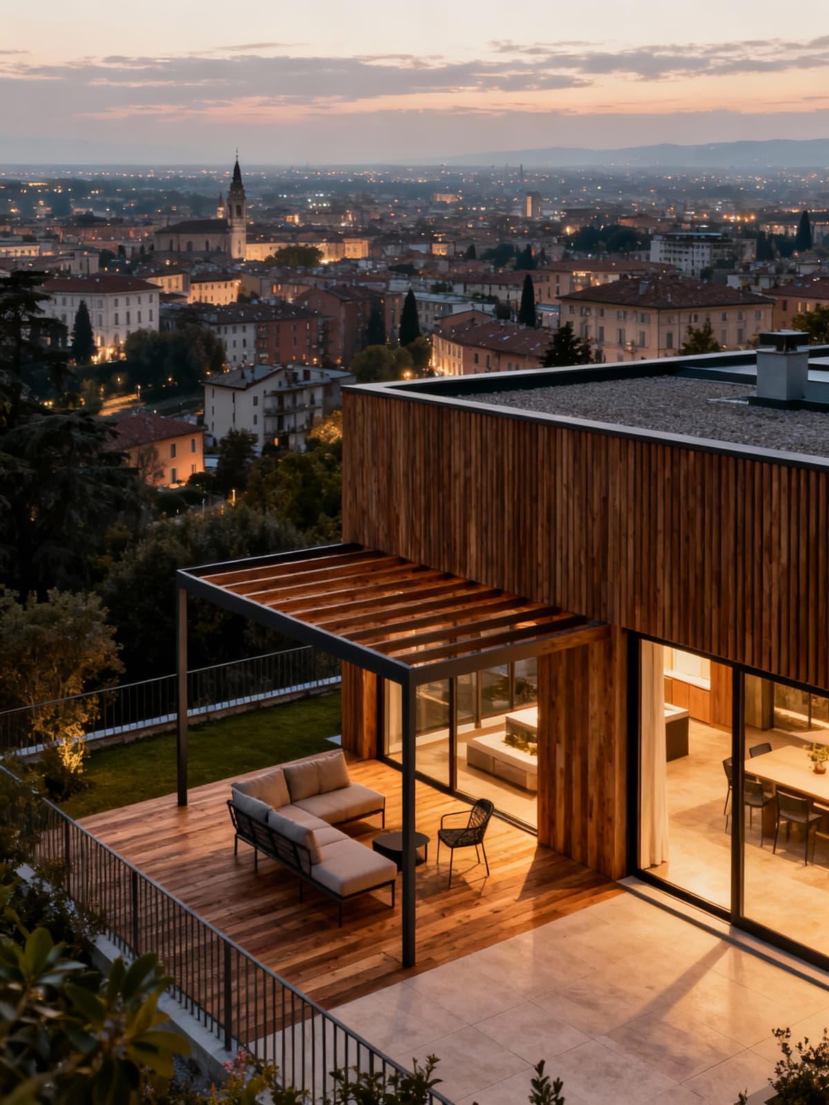 Attici di lusso con vista panoramica sulle città lombarde, spazi esterni eleganti e luce calda serale.