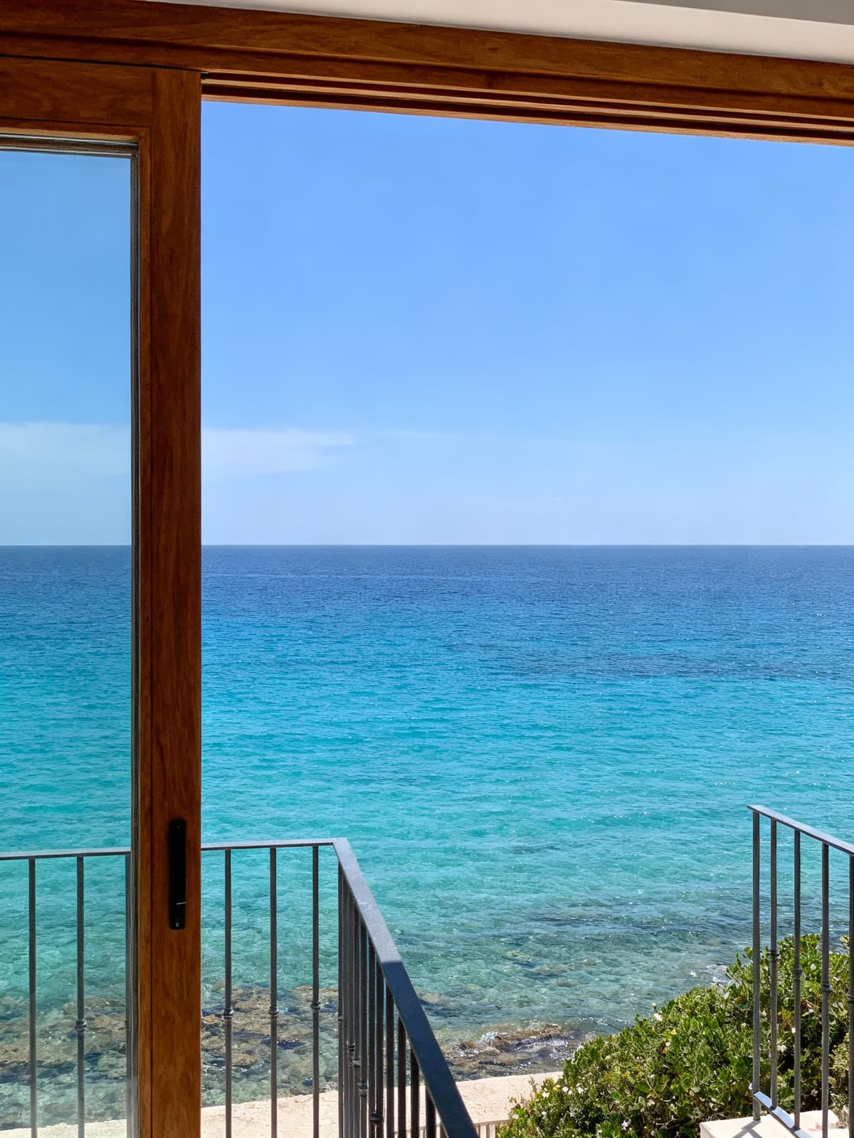 Exclusive beachfront apartment in Lecce, showcasing baroque architecture, natural stone finishes, and a stunning blue sky.