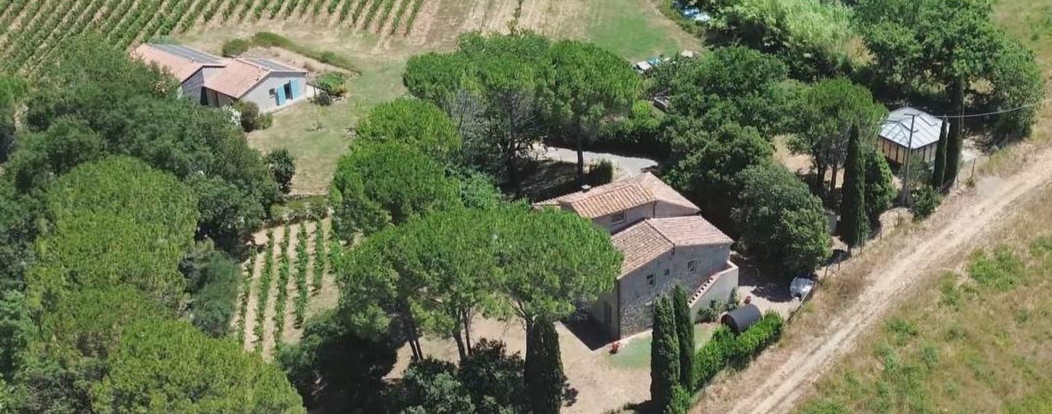 AZ413 Organic winery with a renovated farmhouse, wine cellar, gazebo with wood-fired oven, and land.