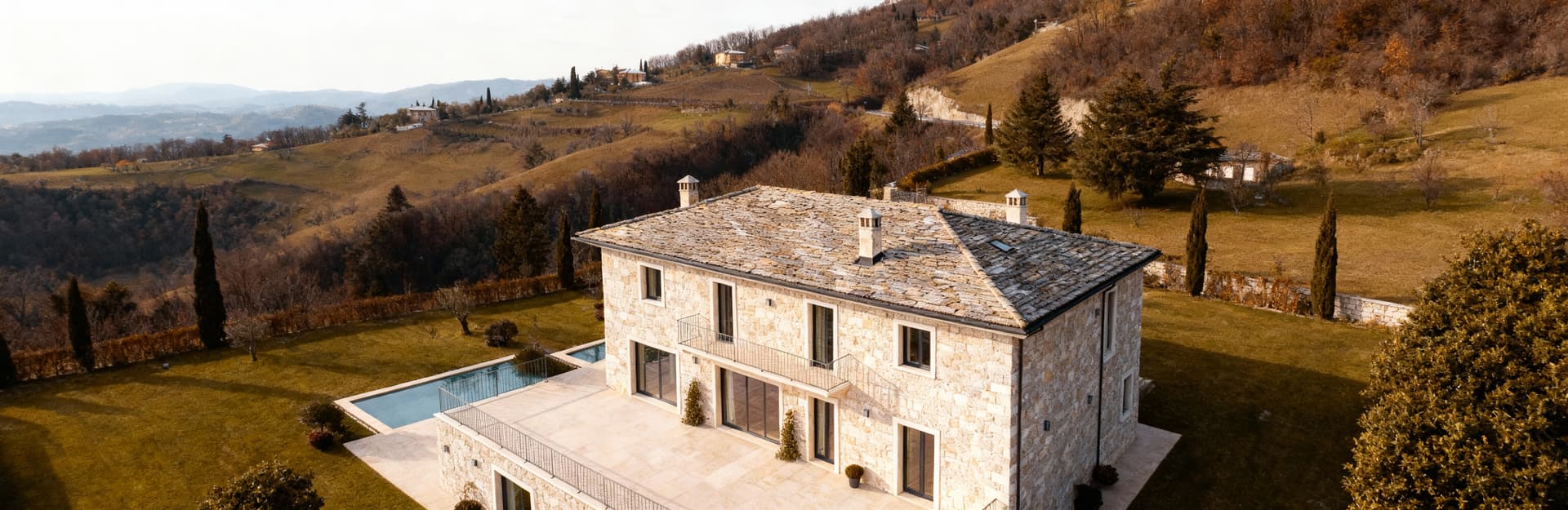 Luxury real estate for sale in Trento, showcasing stunning Dolomite landscapes and historic architecture amidst nature.