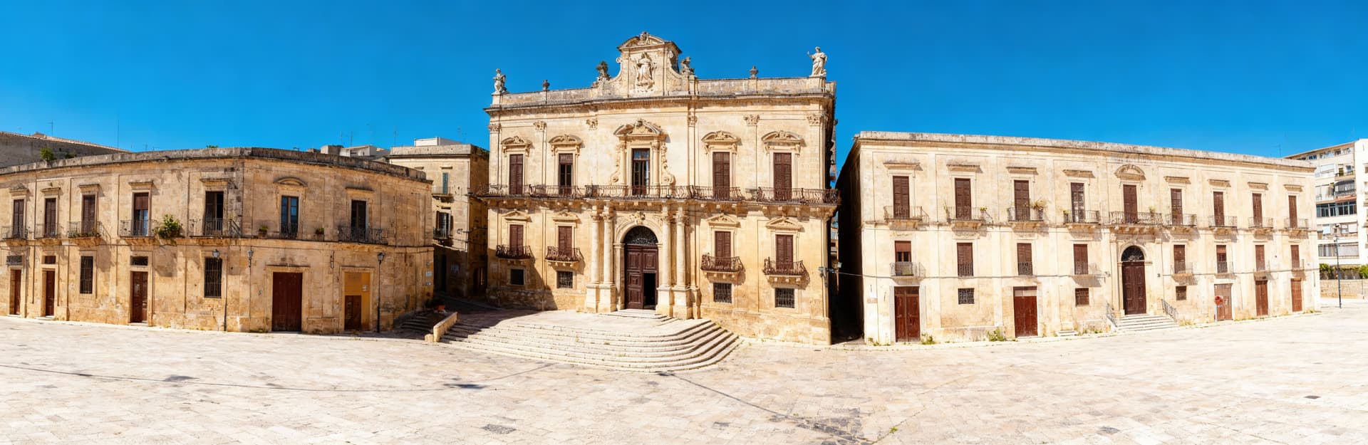 Luxury independent homes for sale in Ragusa, Sicily, featuring stunning sea views and lush landscapes near historic architecture.