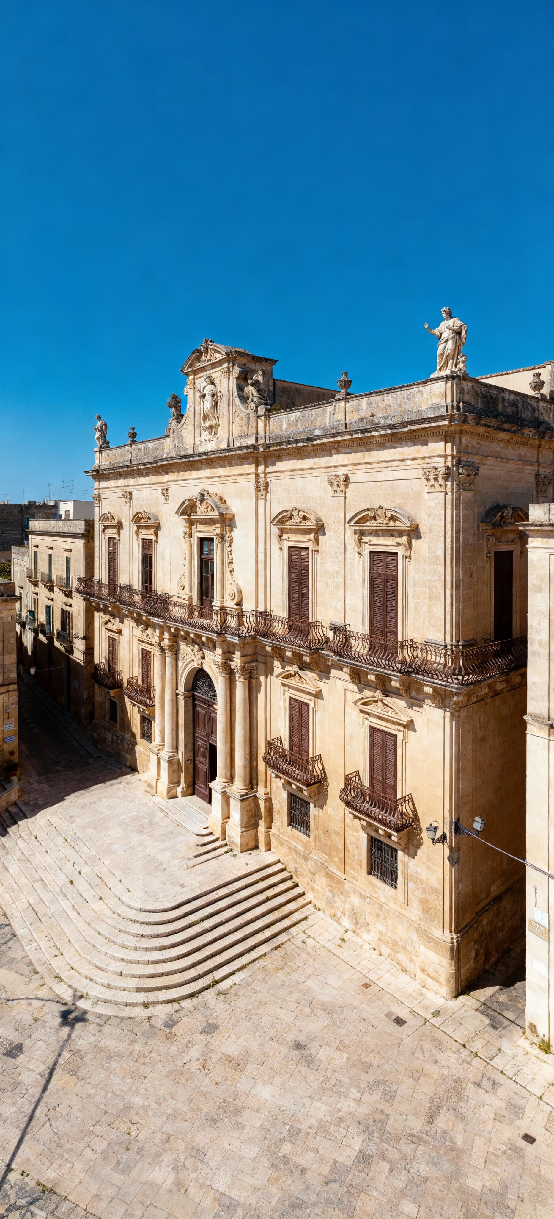 Luxury independent homes for sale in Ragusa, Sicily, featuring stunning sea views and lush landscapes near historic architecture.