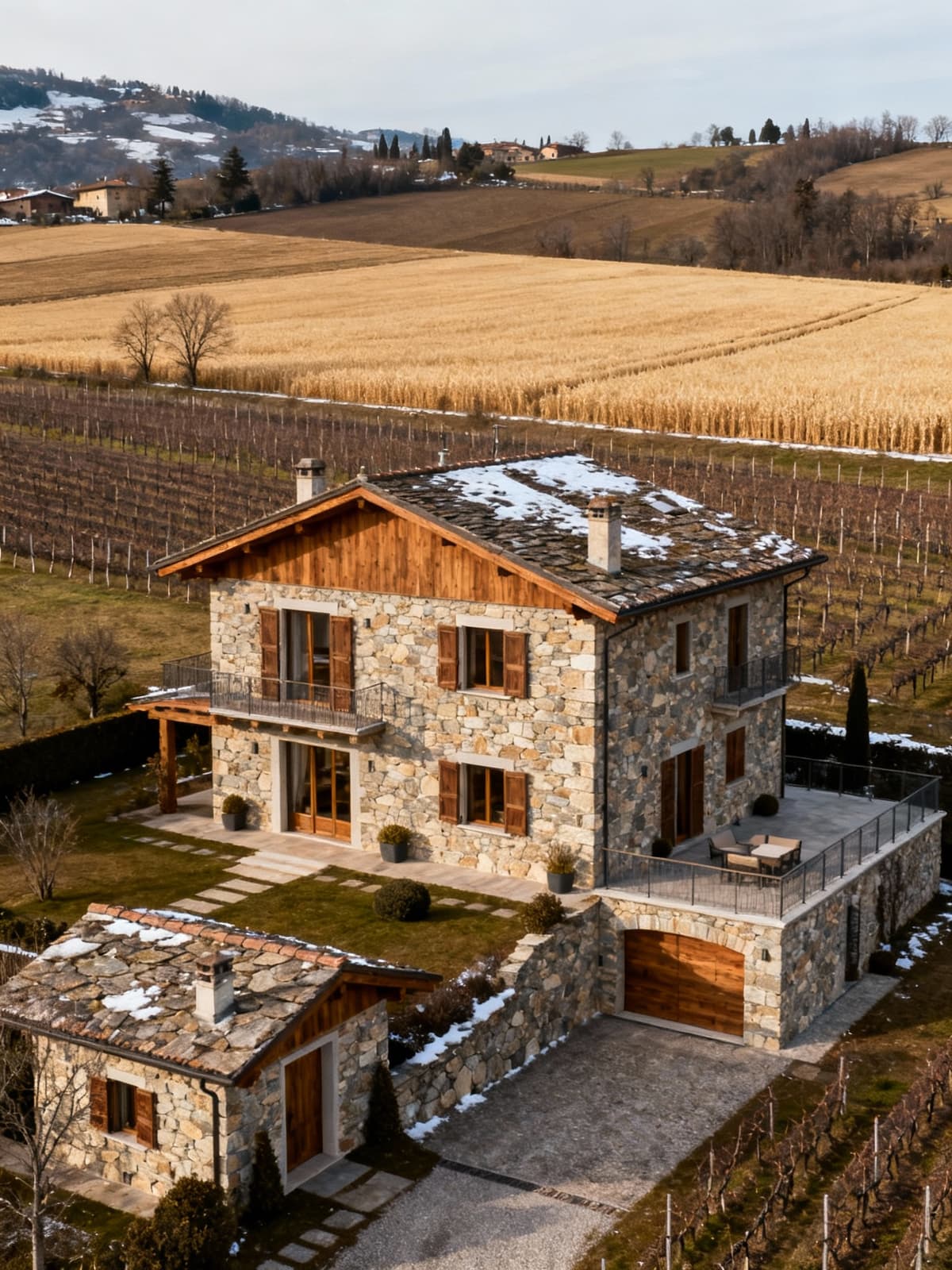 Prestigious villas in the Cuneo countryside amidst wheat fields and vineyards, showcasing natural materials and warm winter light.