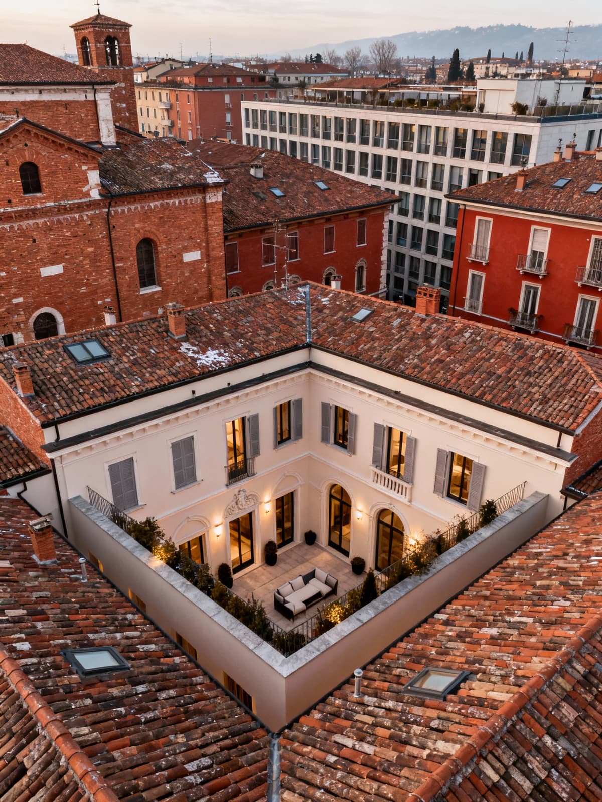 Exclusive townhouse in the heart of Brescia, showcasing a blend of historical and modern architecture, illuminated by soft winter light.